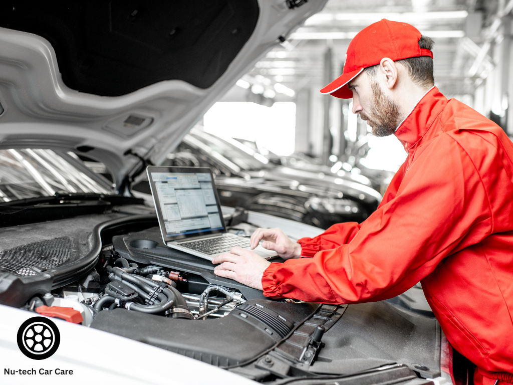 Automotive technician inspecting brakes and engine components