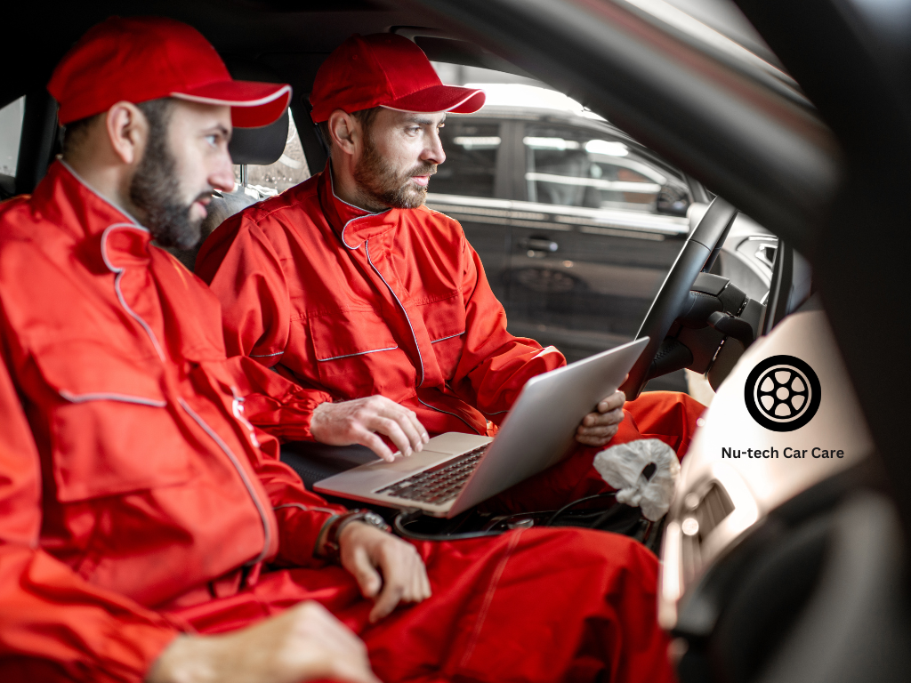 Mechanic conducting comprehensive car maintenance inspection