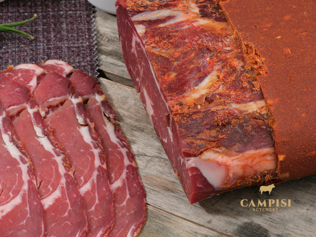 cured meats near me cured meats, salumi vs charcuterie, Salumi plate, salumi set, best salumi, Italian butchery, arranged salami bologna ham and prosciutto 