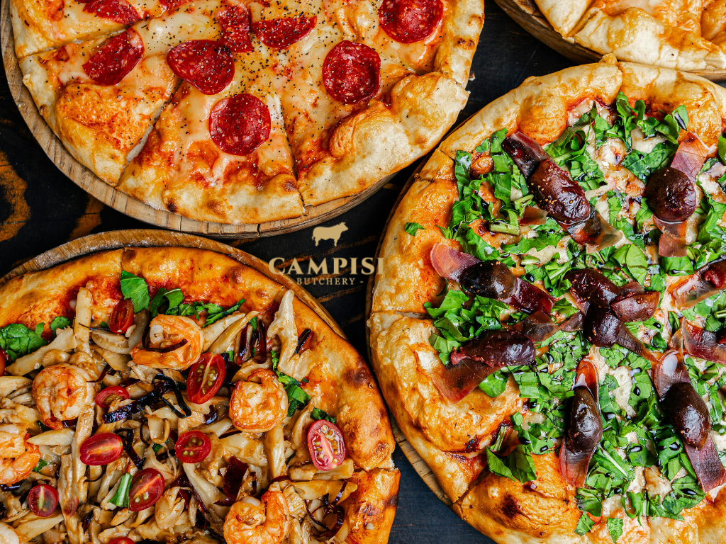 Homemade Italian salumi pizza topped with sliced salami, mozzarella, tomato sauce and fresh basil. salumisalumi meat, salumi italian, italian salumi, salumis, best salumi, types of salumi, salumi vs charcuterie 