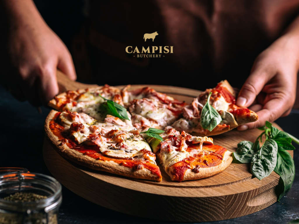 Baked pizza topped with spicy salami, soppressata, melted mozzarella and tomato sauce