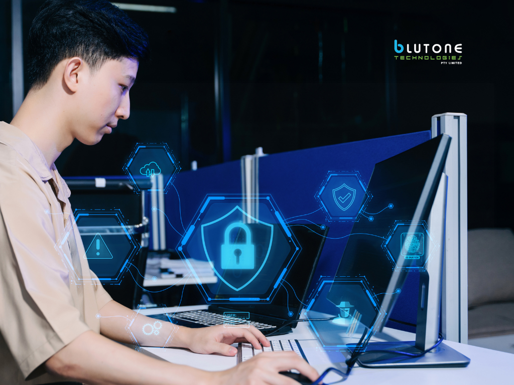 Business employee using a laptop displaying a multi-factor authentication security prompt