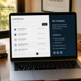 Business professional reviewing local directory listings and company contact information on a laptop