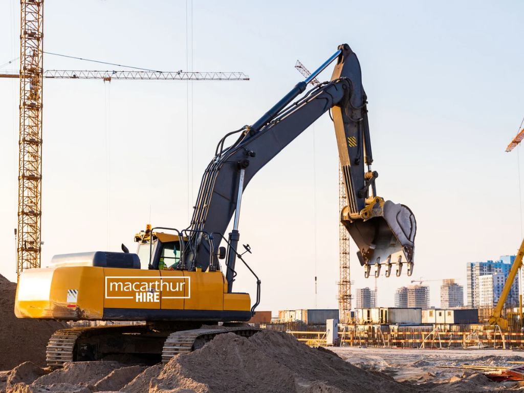 Compact excavator being used for earthmoving and site preparation on a residential construction project.