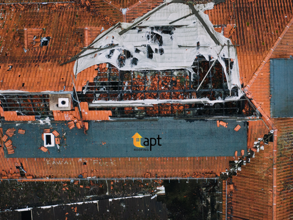 Close-up of cracked and weathered concrete roof tiles on an Australian residential house.