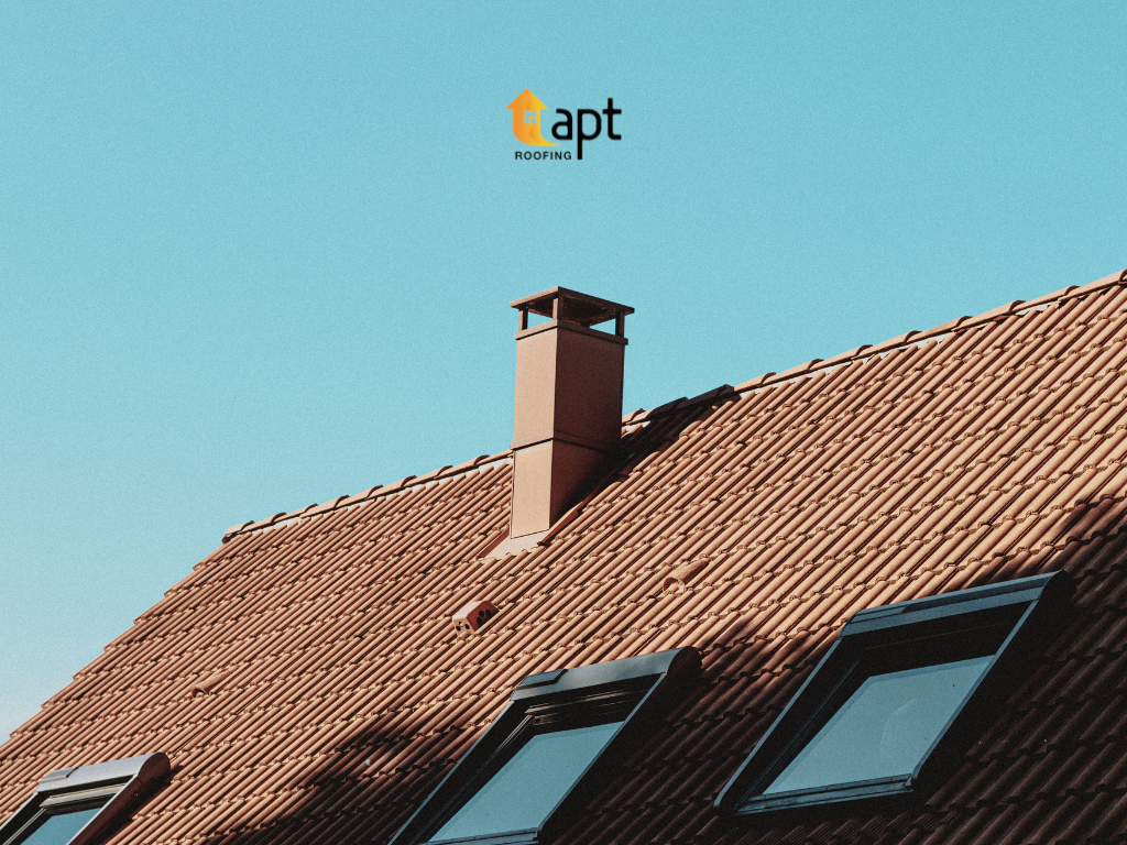 Cracked ridge pointing along the ridge tiles of an older residential tiled roof.