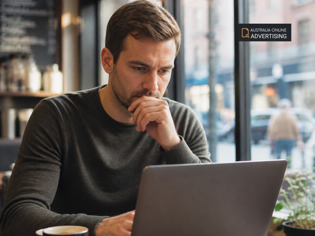 Small business owner comparing Google Business Profile, social media and business directory options on a computer