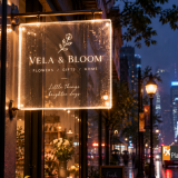 Illuminated shopfront sign with a translucent acrylic panel and evenly diffused LED lighting.